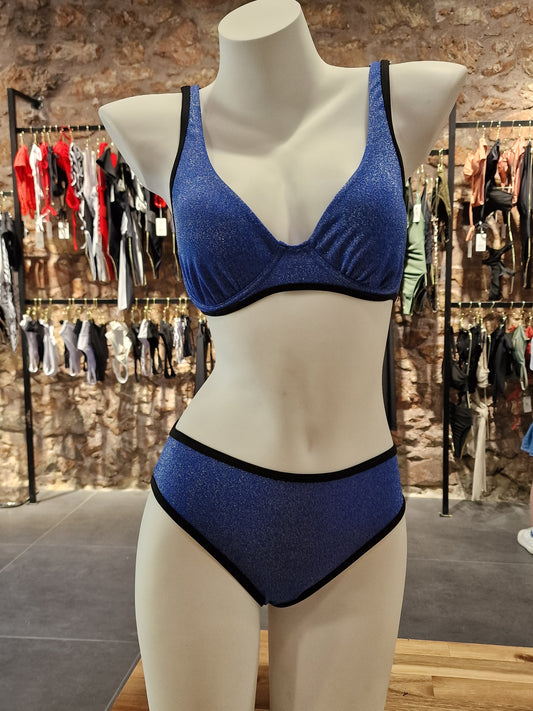 Blue bra on a mannequin with a blurred store background