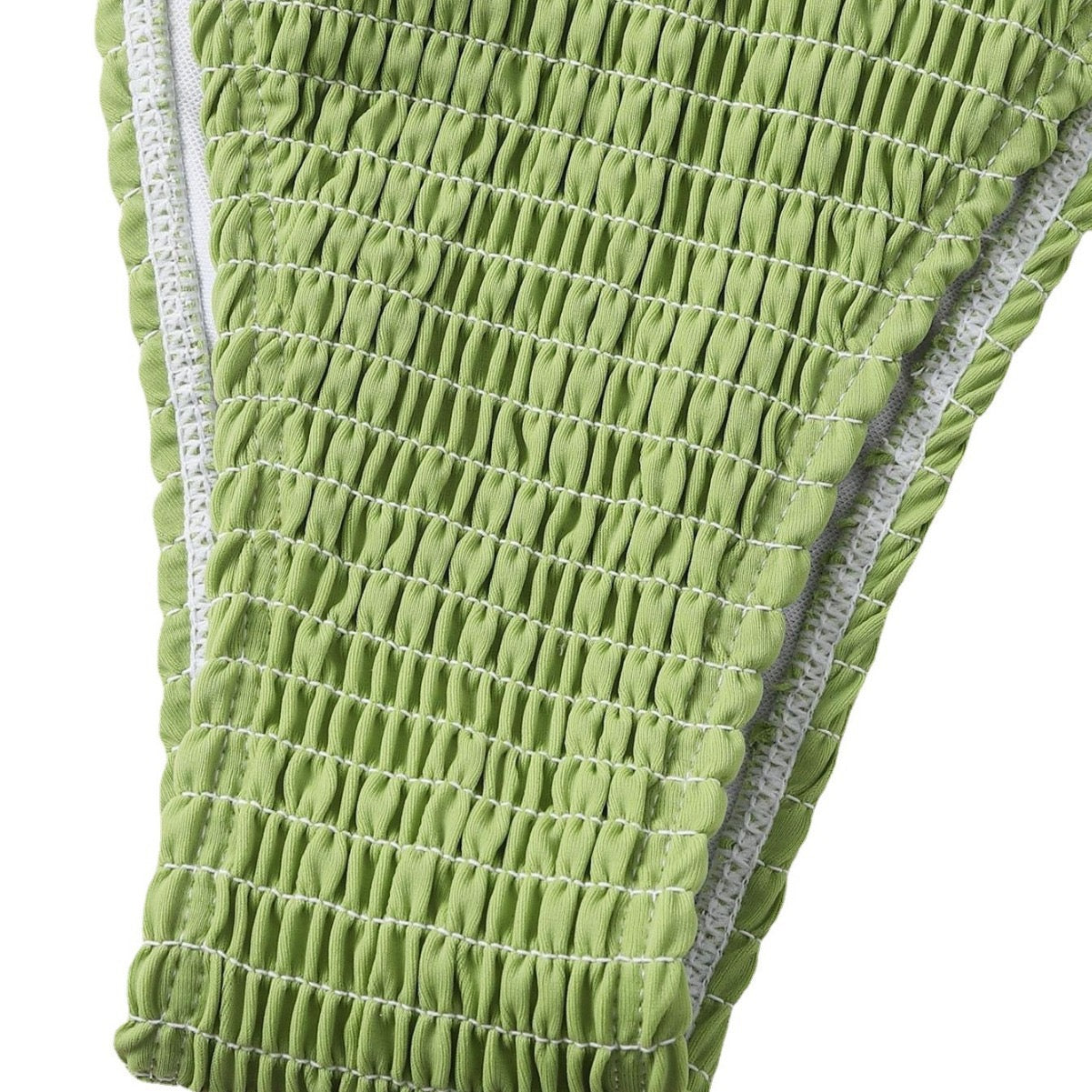 Green textured product with white stitching on a white background