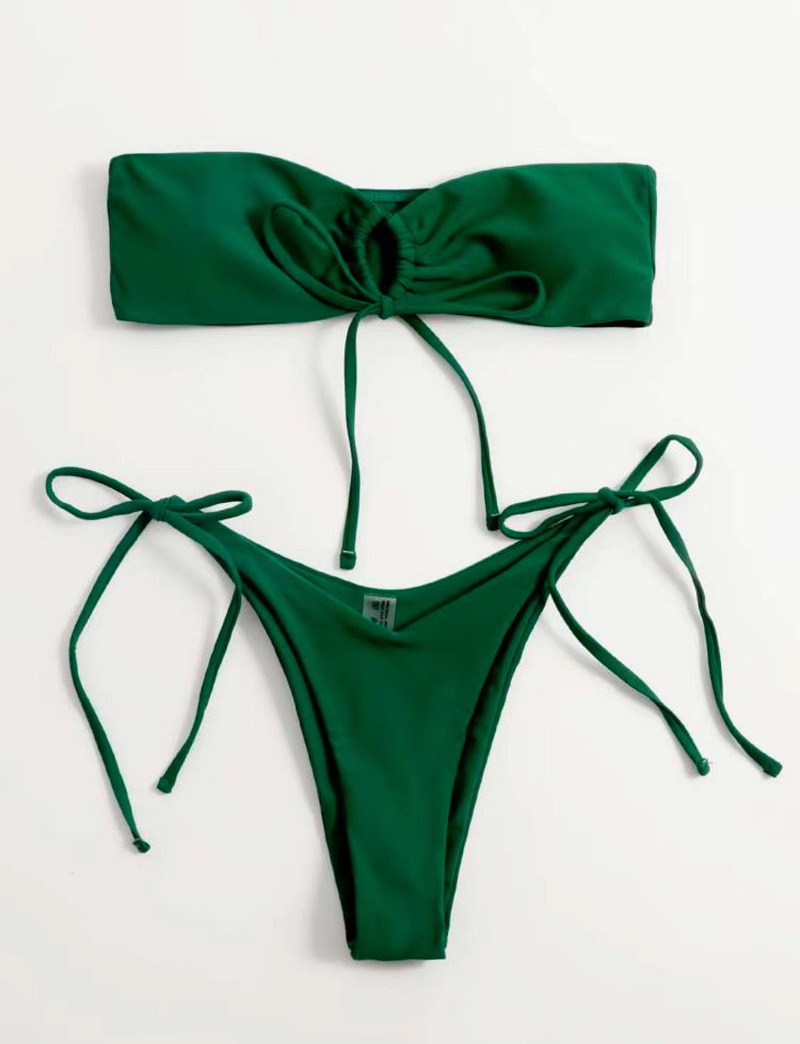 Green bikini set with a strapless top and tie-side bottoms on a white background