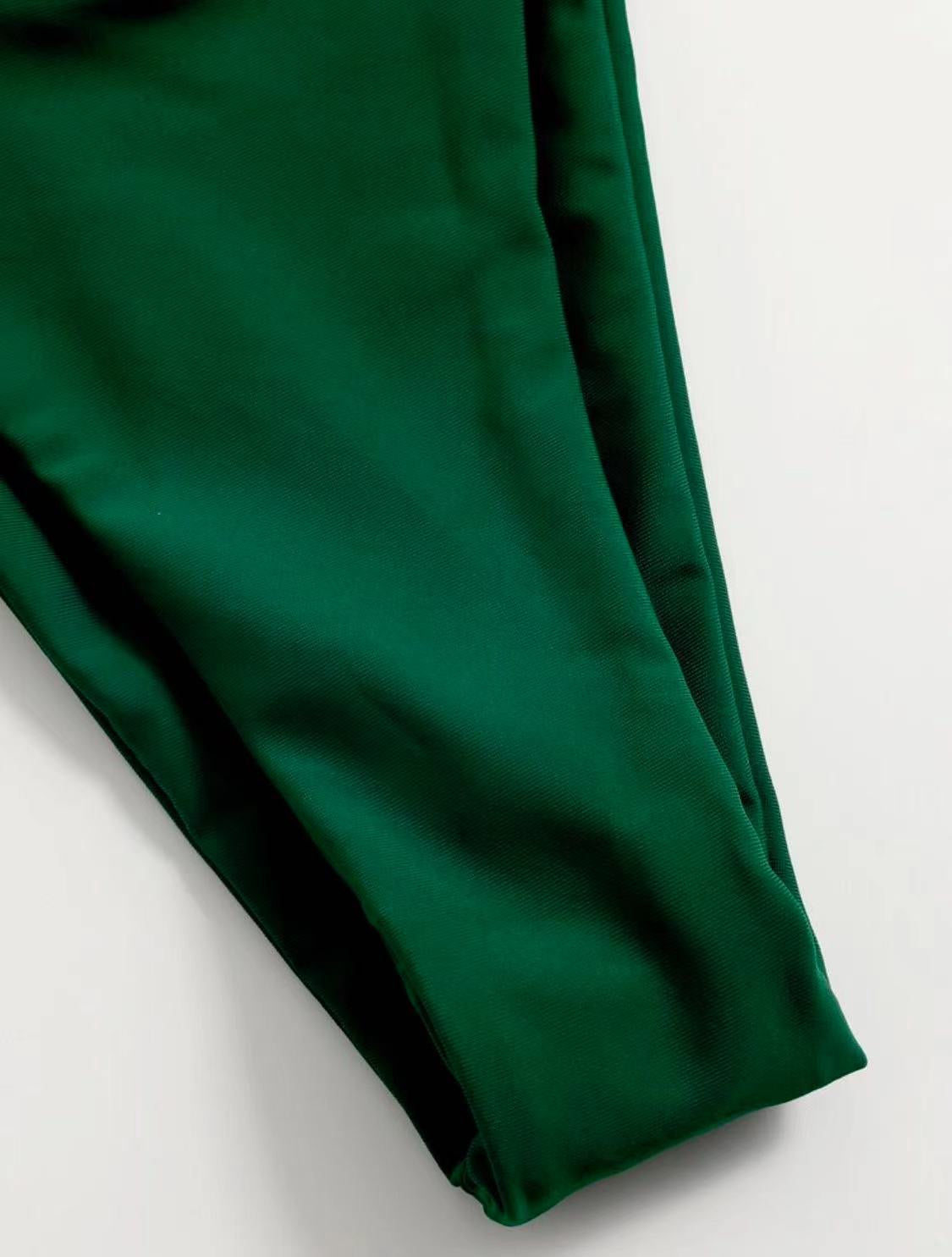 Close-up of a green fabric on a light gray background