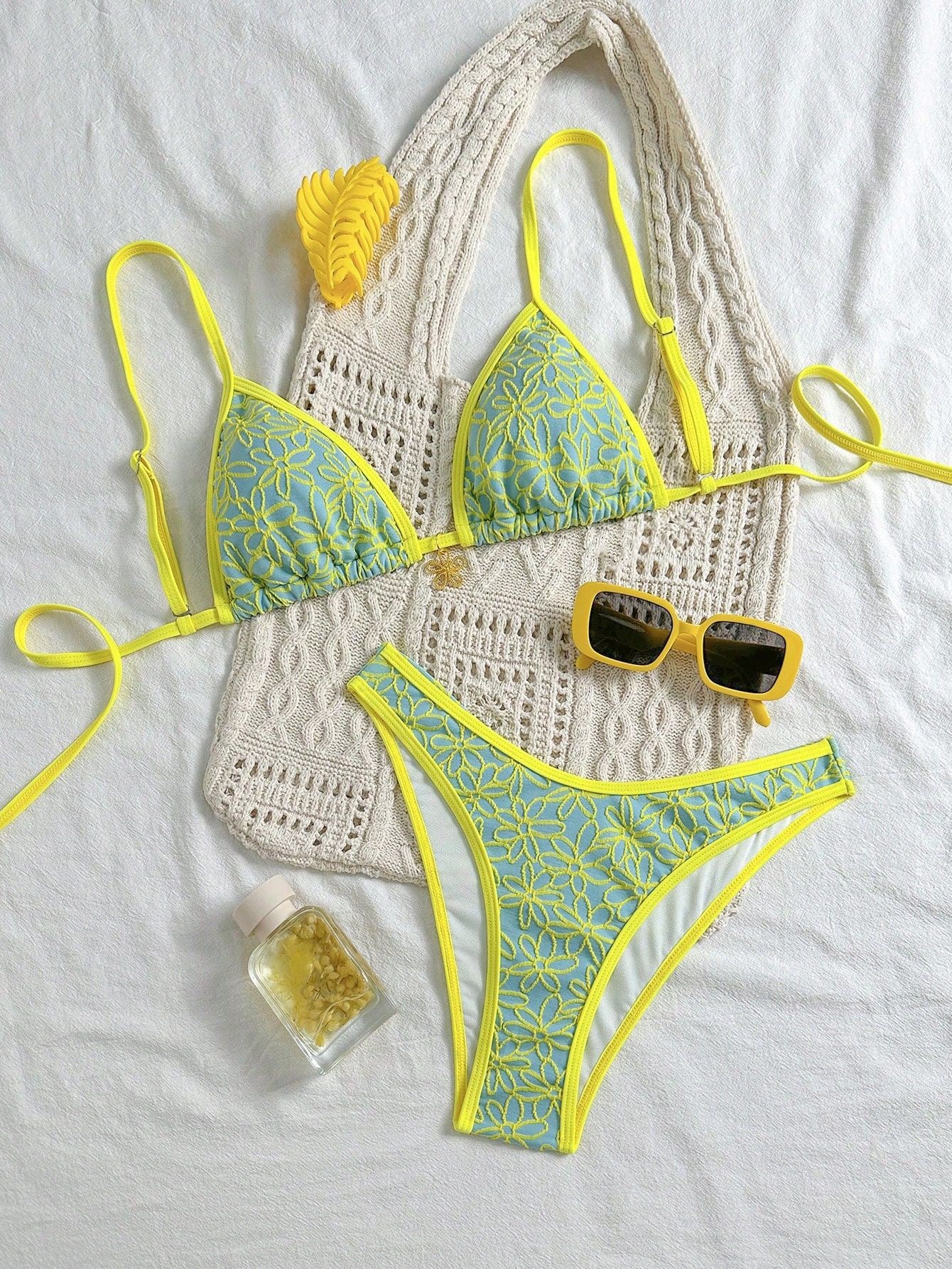 Bikini set with yellow and green pattern on a white background