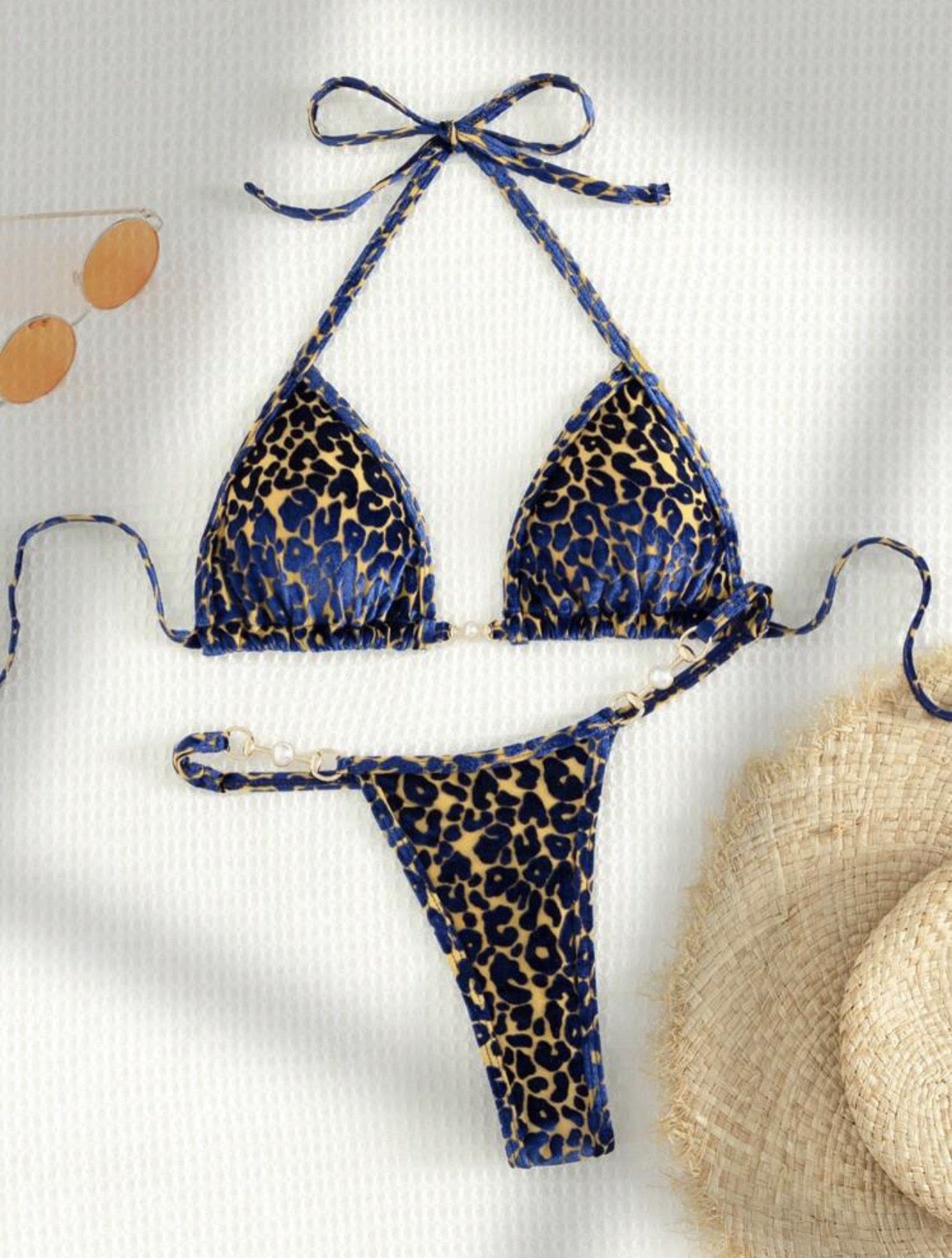 Leopard print bikini set on a light background