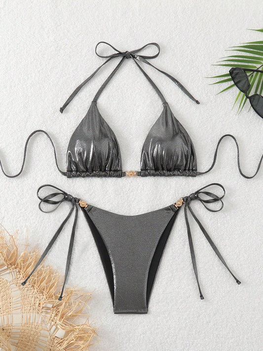 Gray bikini set with bow details on a light gray background