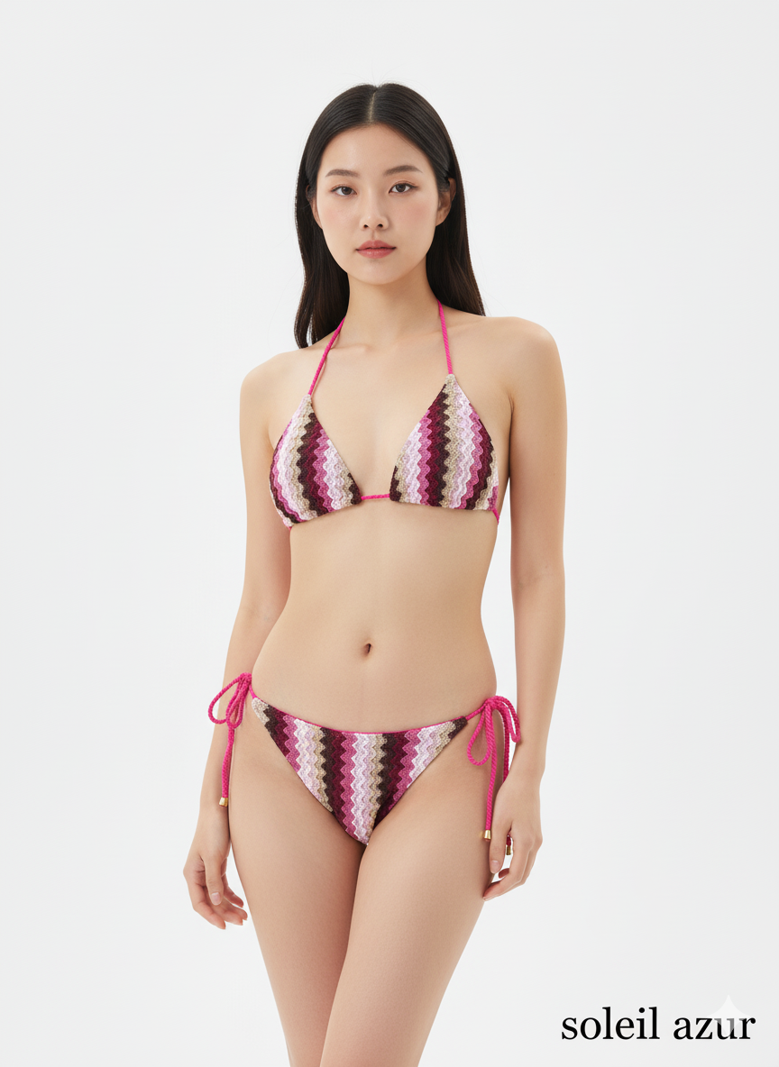 Woman wearing a colorful bikini set with 'soleil azur' branding on a white background